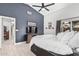 Comfortable bedroom featuring a tv, skylight, sliding door closet, and outside access at 4013 E Woodland Dr, Phoenix, AZ 85048