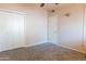 Bedroom with carpet, closet, and access door at 412 W Fairhaven Rd, Kearny, AZ 85137