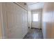 Hallway with closet and exterior door leading to the backyard at 412 W Fairhaven Rd, Kearny, AZ 85137