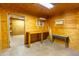 Outbuilding with shelving and workbench, featuring ample natural light, and a storage area at 412 W Fairhaven Rd, Kearny, AZ 85137