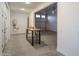 Unfinished two-car garage featuring concrete flooring, an exposed water heater, and an open entryway at 43720 N Acadia Way, New River, AZ 85087