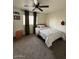 This carpeted bedroom has a ceiling fan and a cozy, comfortable feel at 4537 N 26Th Dr, Phoenix, AZ 85017