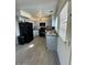 Charming kitchen featuring white cabinetry, stainless steel appliances, and wood-look floors at 4537 N 26Th Dr, Phoenix, AZ 85017