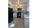 Well-maintained kitchen featuring stainless steel appliances, granite countertops, and wood-look floors at 4537 N 26Th Dr, Phoenix, AZ 85017