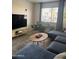 Comfortable living room features a plush sectional, modern decor, and plenty of natural light at 4537 N 26Th Dr, Phoenix, AZ 85017