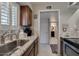 Bright kitchen with stainless steel sink, granite countertops and modern fixtures at 4610 N 68Th St # 421, Scottsdale, AZ 85251