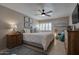 Relaxing main bedroom with a ceiling fan and bright windows with shutters at 4610 N 68Th St # 421, Scottsdale, AZ 85251