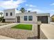 Modern home showcasing clean lines, a xeriscaped front yard, and desert landscaping at 6525 N 83Rd St, Scottsdale, AZ 85250