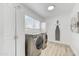 Well-lit laundry room with modern appliances and ample storage space at 6525 N 83Rd St, Scottsdale, AZ 85250