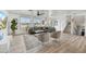 Bright living room with stylish seating, wood floors, and large windows at 6525 N 83Rd St, Scottsdale, AZ 85250