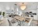 Open-concept living area with dining table, modern kitchen, and comfortable seating at 6525 N 83Rd St, Scottsdale, AZ 85250