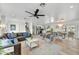 Open-concept living space with modern furnishings and a view of the kitchen and dining area at 6525 N 83Rd St, Scottsdale, AZ 85250
