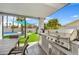 Built-in stainless steel outdoor barbecue is ready for entertaining next to an outdoor dining table at 6525 N 83Rd St, Scottsdale, AZ 85250