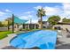 Large pool and backyard with a sunshade, patio area, and barbecue, perfect for summer entertaining at 6525 N 83Rd St, Scottsdale, AZ 85250