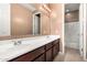 Spacious bathroom with dual sinks, large mirror, and a walk-in shower at 7975 W Andrea Dr, Peoria, AZ 85383