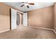 Bedroom with carpeted flooring and natural light, showcasing accessibility to other rooms at 7975 W Andrea Dr, Peoria, AZ 85383