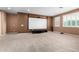 Spacious media room ready for entertainment, featuring a screen, projector, and cozy carpeting at 7975 W Andrea Dr, Peoria, AZ 85383
