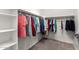 Walk-in closet with built-in shelving and hanging racks for ample storage at 7975 W Andrea Dr, Peoria, AZ 85383
