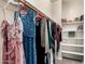 Walk-in closet with ample storage, shelving, and hanging clothes at 7975 W Andrea Dr, Peoria, AZ 85383