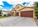 Charming home features stucco exterior, a tile roof, and an expansive concrete driveway at 7975 W Andrea Dr, Peoria, AZ 85383