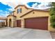 Stunning home featuring a tile roof, attached three-car garage, and long driveway at 7975 W Andrea Dr, Peoria, AZ 85383