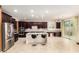 Spacious kitchen with stainless steel appliances, a center island and a tile backsplash at 7975 W Andrea Dr, Peoria, AZ 85383