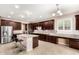 Spacious kitchen with a center island, stainless steel appliances, and granite countertops at 7975 W Andrea Dr, Peoria, AZ 85383