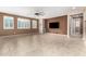 Generous living area with tile flooring, large windows, and ceiling fan at 7975 W Andrea Dr, Peoria, AZ 85383