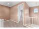 Cozy loft area with plush carpeting and a view to the upstairs hall at 7975 W Andrea Dr, Peoria, AZ 85383