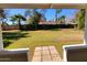 Lush backyard view framed by a covered patio, highlighting the expansive outdoor space and landscaping at 8002 N 5Th Ave, Phoenix, AZ 85021