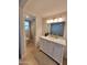 Well-maintained bathroom with tiled floors, a modern vanity, and a walk-in shower at 8002 N 5Th Ave, Phoenix, AZ 85021