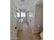 Well-lit bathroom features a white vanity with dual sinks and gold fixtures and a bathtub at 8002 N 5Th Ave, Phoenix, AZ 85021