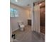 Updated bathroom showcasing a vanity, toilet, hexagon tile floors, and a tiled shower with curtain at 8002 N 5Th Ave, Phoenix, AZ 85021
