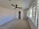 This bedroom offers a serene atmosphere with a ceiling fan, closet, and natural light at 8002 N 5Th Ave, Phoenix, AZ 85021