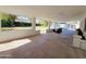 A view of the covered patio area with seating, offering a comfortable and stylish outdoor space at 8002 N 5Th Ave, Phoenix, AZ 85021