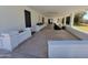 Expansive covered patio with neutral tones, modern chairs, and access to the backyard, ideal for outdoor living at 8002 N 5Th Ave, Phoenix, AZ 85021