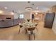 Open concept space with living room and dining room that features tiled floors at 8002 N 5Th Ave, Phoenix, AZ 85021