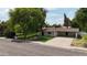 Charming single-story home with a well-kept lawn, mature trees, and a spacious driveway near the street at 8002 N 5Th Ave, Phoenix, AZ 85021