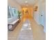 Bright and airy entryway featuring tiled floors, a decorative rug, and a comfortable bench at 8002 N 5Th Ave, Phoenix, AZ 85021