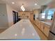 Bright kitchen featuring a large island with quartz countertop, modern appliances and ample cabinetry at 8002 N 5Th Ave, Phoenix, AZ 85021