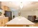 Spacious kitchen island with seating, stainless steel appliances, and an open layout at 8002 N 5Th Ave, Phoenix, AZ 85021