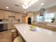 Bright kitchen featuring a large island with quartz countertop and modern appliances at 8002 N 5Th Ave, Phoenix, AZ 85021