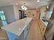 Bright kitchen featuring a large island with quartz countertop, modern appliances and ample cabinetry at 8002 N 5Th Ave, Phoenix, AZ 85021
