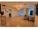 Open living room with modern chandelier, neutral colors, and a comfortable seating area at 8002 N 5Th Ave, Phoenix, AZ 85021