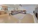 Spacious living room with tile floors, a gray sectional sofa, and a stylish patterned rug at 8002 N 5Th Ave, Phoenix, AZ 85021