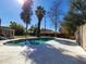 Backyard pool area featuring a refreshing pool, lounge area, and mature trees, creating a private retreat at 8002 N 5Th Ave, Phoenix, AZ 85021