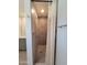 Shower stall featuring hexagon tiling, modern fixtures, and a shower curtain at 8002 N 5Th Ave, Phoenix, AZ 85021