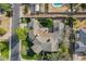 Bird's-eye view of a home featuring a circular driveway, lush landscaping, mature trees, and a well-maintained lawn at 801 W Tyson St, Chandler, AZ 85225
