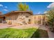 Well-kept backyard with a shed and utility connections, complemented by a lush lawn at 801 W Tyson St, Chandler, AZ 85225