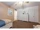 Bright bedroom with neutral walls, ceiling fan and closet at 801 W Tyson St, Chandler, AZ 85225